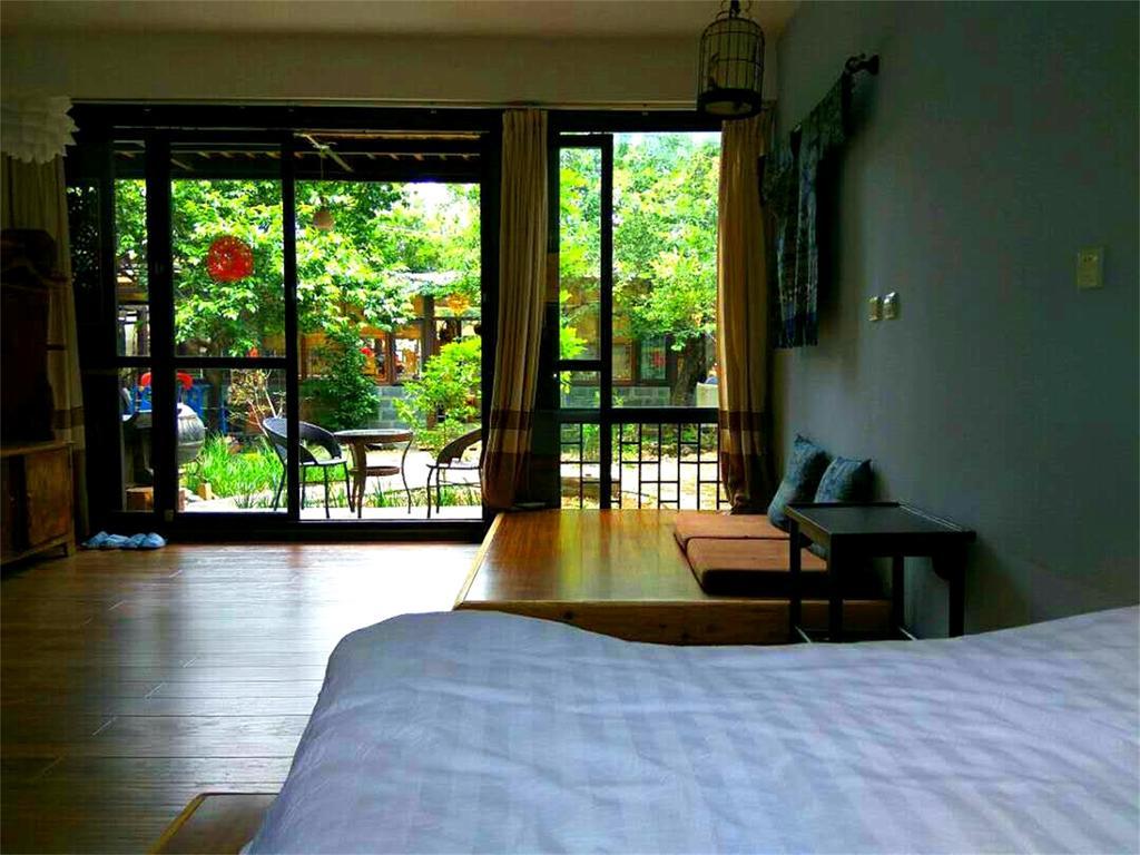 Lijiang Baisha Free Time Designed Hotel Exterior foto
